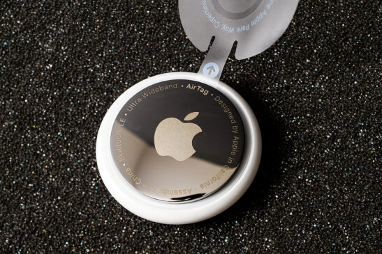 Image shows Apple AirTag in case with holder.