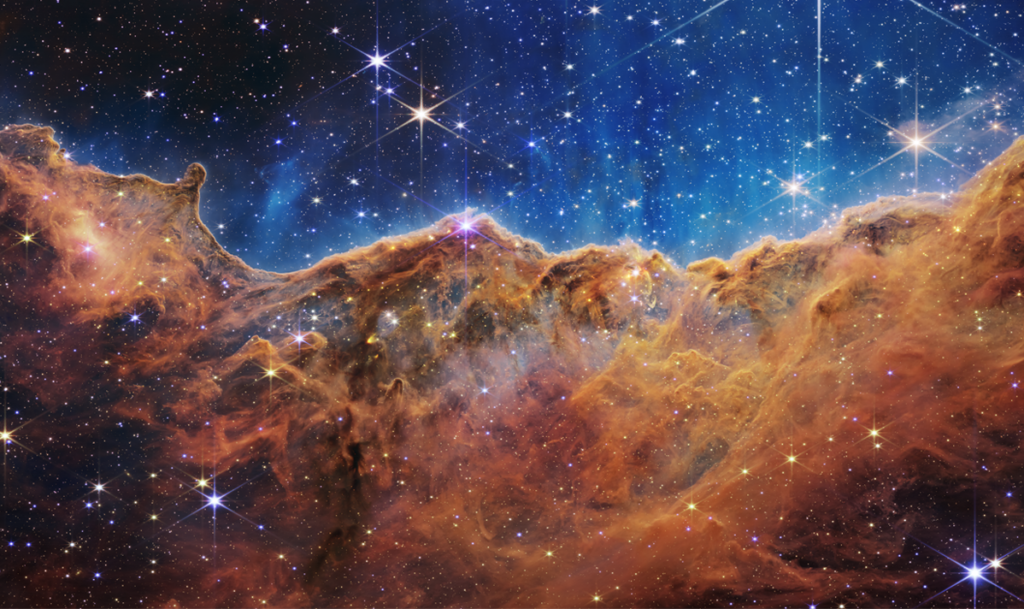 James Web Image: “Cosmic Cliffs” in the Carina Nebula courtesy of NASA and STScI