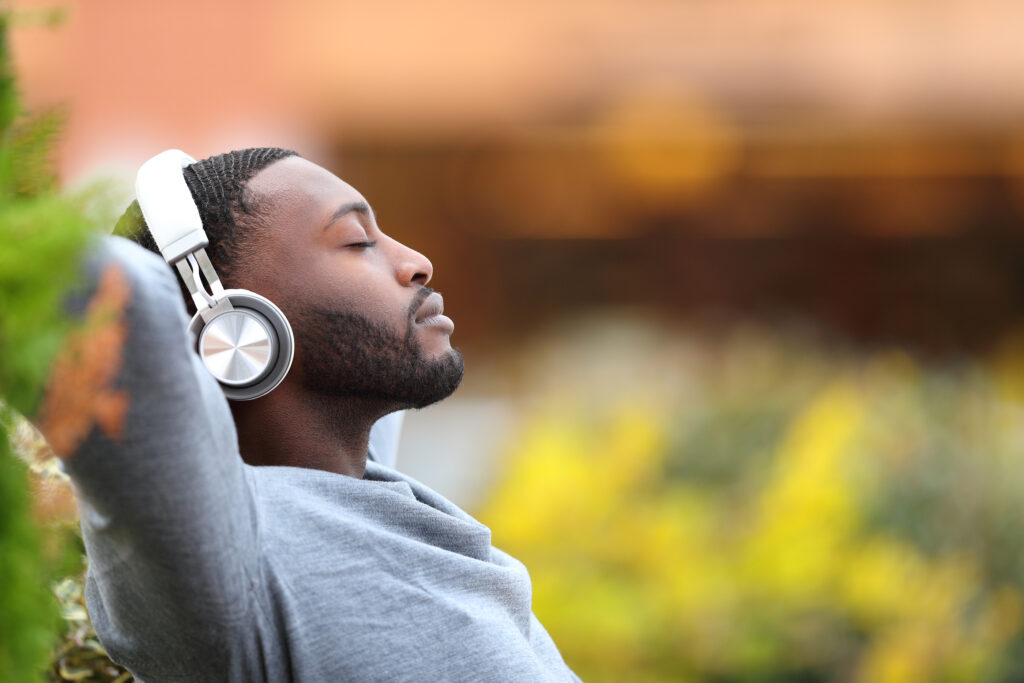 Man with headphones relaxes with music