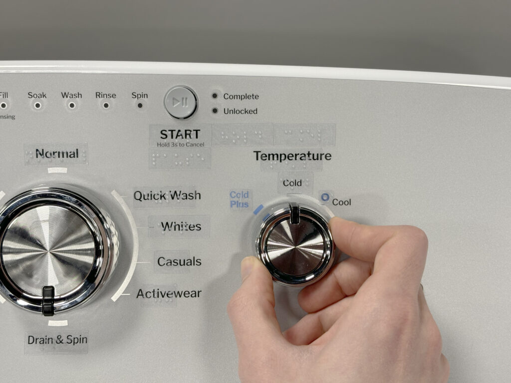GE washer controls with transparent tactile stickers